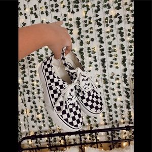 super cute white and black laced up checkered vans